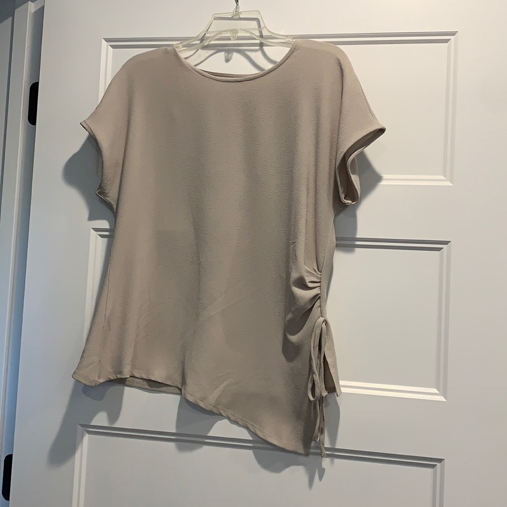 Cream colored short sleeve blouse